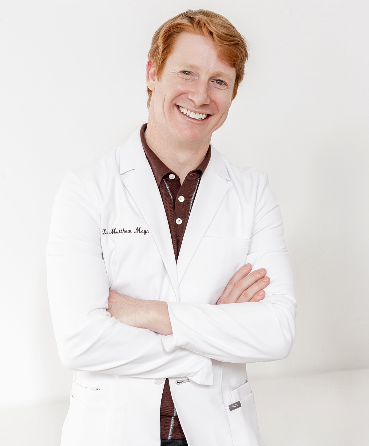 Smiling doctor in a white lab coat.