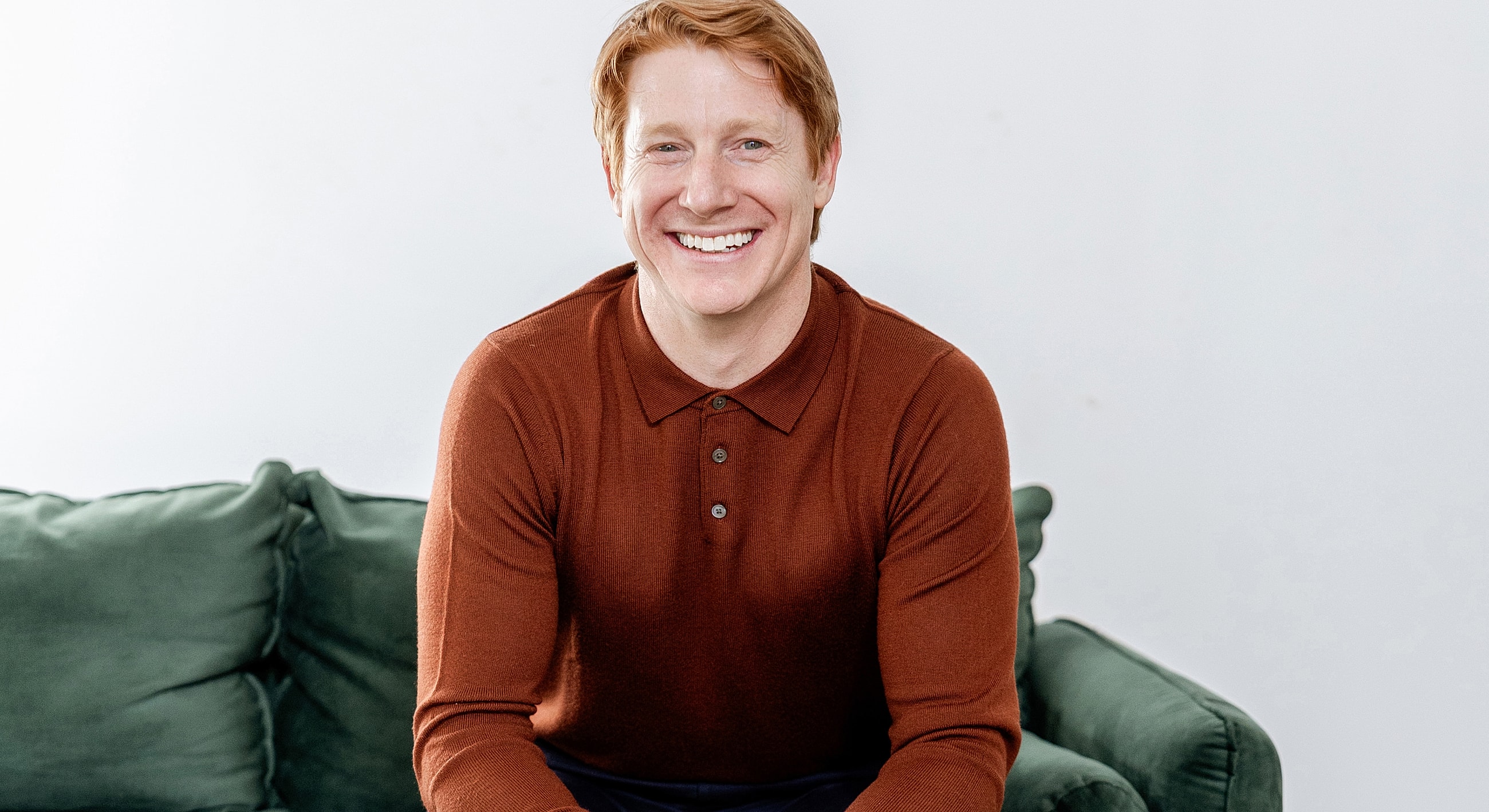 Person looking out a window, nature background.
